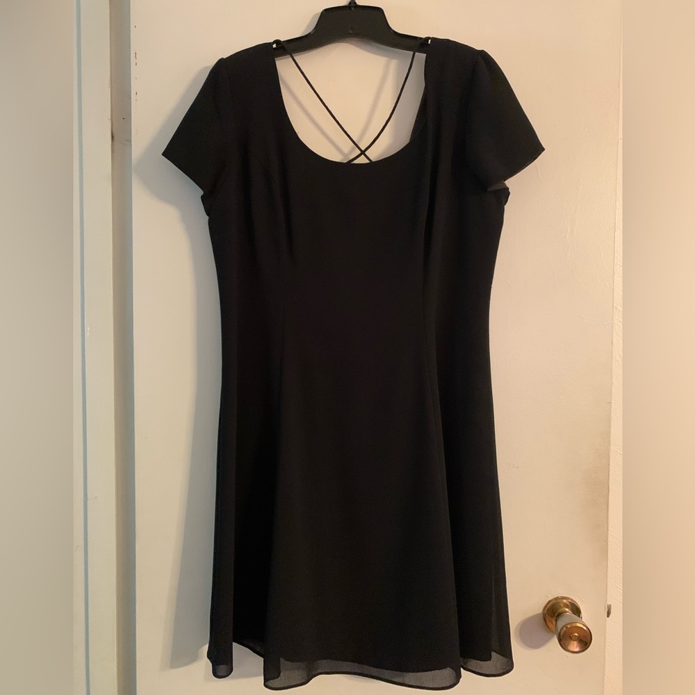 Ladies black knee length dress.